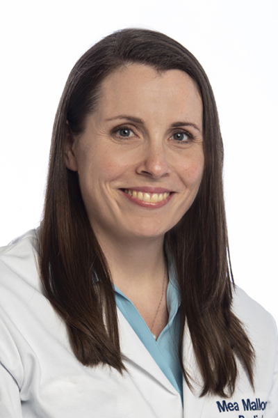 Dr. Mary Mallon, board-certified radiologist at Princeton Radiology, smiling in a professional headshot wearing a white lab coat and light blue blouse.